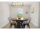 Bright dining area with window and modern decor at 3784 Pama Ln, Las Vegas, NV 89120