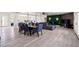 Open concept dining room with seating for eight and wood-look flooring at 3784 Pama Ln, Las Vegas, NV 89120
