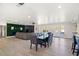 Large dining area with a long table and chairs, view to backyard at 3784 Pama Ln, Las Vegas, NV 89120