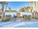 Inviting front entrance with palm trees and landscaping at 3784 Pama Ln, Las Vegas, NV 89120