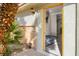 Inviting entryway with a yellow door and small patio area at 3784 Pama Ln, Las Vegas, NV 89120