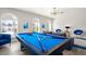 Game room with blue pool table and comfy seating at 3784 Pama Ln, Las Vegas, NV 89120