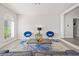 Living room with blue accent chairs and modern coffee table at 3784 Pama Ln, Las Vegas, NV 89120