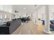 Open living space with gray sofa and views to kitchen at 3784 Pama Ln, Las Vegas, NV 89120