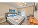 Inviting primary bedroom features a cozy bed, stylish lighting, and calming decor elements at 3784 Pama Ln, Las Vegas, NV 89120