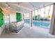 Covered patio bar with checkered design and pool view at 3784 Pama Ln, Las Vegas, NV 89120