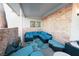 Inviting patio with blue seating and stone wall at 3784 Pama Ln, Las Vegas, NV 89120