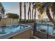 Hot tub with surrounding landscape and pool in background at 3784 Pama Ln, Las Vegas, NV 89120