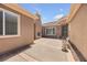 Charming courtyard with decorative statues and elegant architectural details creating a welcoming outdoor space at 7145 Cypress Run Dr, Las Vegas, NV 89131