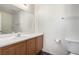This cozy bathroom has a single sink vanity with drawers and a large framed mirror at 9333 Leaping Deer Pl # 102, Las Vegas, NV 89178