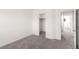 Another bedroom featuring neutral walls and carpet, with closet and door to hallway at 9333 Leaping Deer Pl # 102, Las Vegas, NV 89178