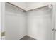 A simple closet design features a wooden rod for hanging clothes and neutral paint at 9333 Leaping Deer Pl # 102, Las Vegas, NV 89178
