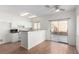 Bright, updated kitchen with white cabinets, sleek appliances, and sliding door access to backyard at 9333 Leaping Deer Pl # 102, Las Vegas, NV 89178