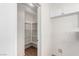 Walk-in pantry with ample shelving, offering great storage space adjacent to the kitchen at 9333 Leaping Deer Pl # 102, Las Vegas, NV 89178
