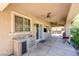 The back patio features a built-in outdoor kitchen with stainless steel refrigerator, sink, and overlooks the landscaped backyard at 5301 Fairbranch Ln, Las Vegas, NV 89135