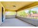 Relaxing outdoor balcony with a wrought-iron railing, overhead lighting, and serene views of the landscape at 5301 Fairbranch Ln, Las Vegas, NV 89135