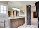 Elegant bathroom featuring dual sinks, marble countertops, custom cabinets, and access to the bedroom at 5301 Fairbranch Ln, Las Vegas, NV 89135