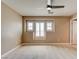 Well-lit bedroom featuring neutral walls, carpet, recessed window, and a ceiling fan at 5301 Fairbranch Ln, Las Vegas, NV 89135