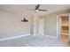 Spacious bedroom with neutral walls, a ceiling fan, and walk-in closet at 5301 Fairbranch Ln, Las Vegas, NV 89135
