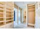 Spacious walk-in closet with built-in shelving and drawers for efficient storage and organization at 5301 Fairbranch Ln, Las Vegas, NV 89135