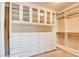 Custom closet with built-in shelving, drawers, and cabinets providing ample storage space at 5301 Fairbranch Ln, Las Vegas, NV 89135