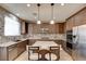 Gourmet kitchen featuring granite counters, stainless appliances, and center island at 5301 Fairbranch Ln, Las Vegas, NV 89135