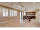Bright living room with shuttered windows, wood floors, and view into the kitchen at 5301 Fairbranch Ln, Las Vegas, NV 89135