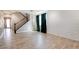 Modern living room featuring tile floors, staircase, and an accent wall at 5301 Fairbranch Ln, Las Vegas, NV 89135