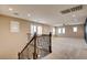 A spacious loft features plush carpeting, a ceiling fan, and plenty of natural light at 5301 Fairbranch Ln, Las Vegas, NV 89135