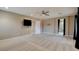 Spacious bedroom featuring plush carpeting, ceiling fan, and media-ready wall at 5301 Fairbranch Ln, Las Vegas, NV 89135