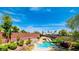 Beautiful backyard pool with a slide and lush landscaping, perfect for outdoor entertainment at 5301 Fairbranch Ln, Las Vegas, NV 89135
