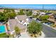 Aerial view of house and neighborhood, showcasing a community pool at 1335 Temporale Dr, Henderson, NV 89052