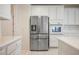 Modern kitchen features stainless steel appliances and white cabinetry at 1335 Temporale Dr, Henderson, NV 89052