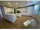 Spacious kitchen with island, white cabinets, and light flooring at 1335 Temporale Dr, Henderson, NV 89052