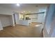 Open concept kitchen with white cabinets and hardwood floors at 1335 Temporale Dr, Henderson, NV 89052