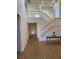 Two-story living room, high ceilings, hardwood floors, and staircase at 1335 Temporale Dr, Henderson, NV 89052