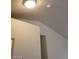 Neutral ceiling with smoke detector and ceiling light fixture at 3505 Benson Ln, North Las Vegas, NV 89032