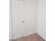 A six-panel interior door with a gold handle complements the neutral wall and trim at 3505 Benson Ln, North Las Vegas, NV 89032