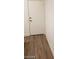 A solid interior door with a metal handle opens onto a hardwood floor at 3505 Benson Ln, North Las Vegas, NV 89032