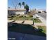 Sunny front yard with grass, rock landscaping and stone walkway to the home at 3505 Benson Ln, North Las Vegas, NV 89032