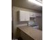 This kitchen features a countertop and white cabinetry at 3505 Benson Ln, North Las Vegas, NV 89032