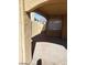 Enclosed patio space with tile flooring and view through the arched opening to the wrought-iron gate at 3505 Benson Ln, North Las Vegas, NV 89032