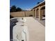 Empty inground pool with a surrounding patio and covered area in the backyard at 3505 Benson Ln, North Las Vegas, NV 89032