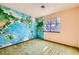 Bedroom featuring an ocean map wall design, carpet, and a window with curtains at 4745 Desert Vista Rd, Las Vegas, NV 89121