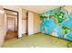 Bedroom with a world map accent wall and closet space at 4745 Desert Vista Rd, Las Vegas, NV 89121