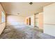 View of carpeted bedroom showcasing vintage wall paper and closet, in need of renovation at 4745 Desert Vista Rd, Las Vegas, NV 89121