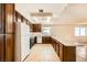 Kitchen featuring white appliances, and wood cabinets at 4745 Desert Vista Rd, Las Vegas, NV 89121