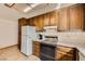 Kitchen featuring white appliances and spacious cabinets at 4745 Desert Vista Rd, Las Vegas, NV 89121