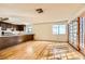 Open living room with light wood floors and double doors at 4745 Desert Vista Rd, Las Vegas, NV 89121