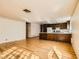 Spacious living room with wood floors open to the kitchen at 4745 Desert Vista Rd, Las Vegas, NV 89121